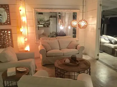 a living room with couches and tables and a mirror at The Bliss of JAVO BEACH in Las Galeras