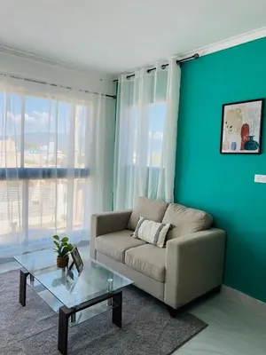 a living room with a couch and a table at Acogedor apartamento in Colorado