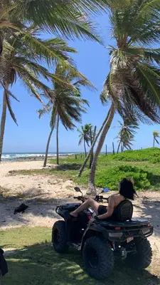 a woman in a quad bike on the beach at ATV Camping in Punta Cana in Punta Cana
