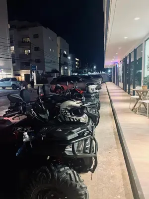a row of motorcycles parked next to a building at ATV Camping in Punta Cana in Punta Cana