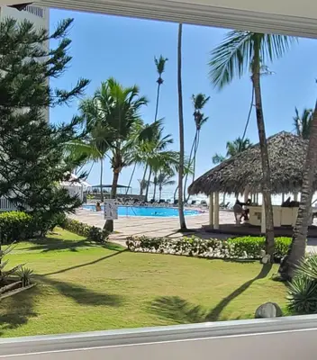 a view of the beach from the window of a resort at Vista paraiso in La Puntica de Juan Dolio