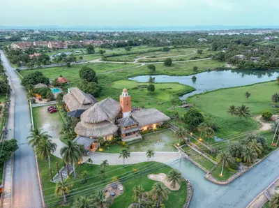 an aerial view of a resort with a church at Penthouse con picuzzi privado y barbacoa en Bávaro in Punta Cana