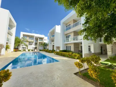 an image of an apartment complex with a swimming pool at Casa Mulata Paseo del Mar 2 Pool & Playa in Punta Cana