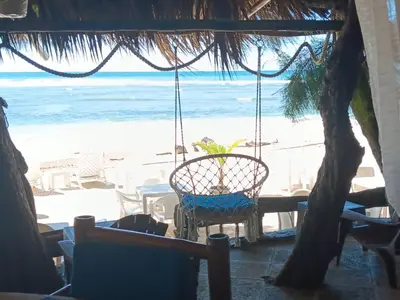 a view of the beach from a restaurant at 1Vida Bar Restaurante in Guayacanes