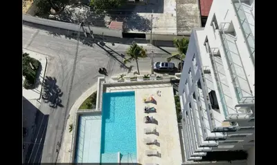 an overhead view of a swimming pool on the side of a building at Ventanas del mar in Los Corrales