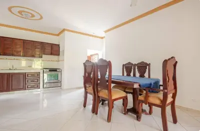 a dining room with a blue table and chairs at Rio San Juan,Spacious,Local,3 Bedroom in Río San Juan
