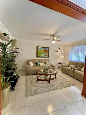 a living room with a couch and a table at FreshBreeze - Apartment Near US Embassy in Santo Domingo
