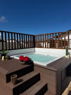 a deck with a plunge pool on a balcony at 3BR & Rooftop Jacuzzi Near Beach in Las Terrenas