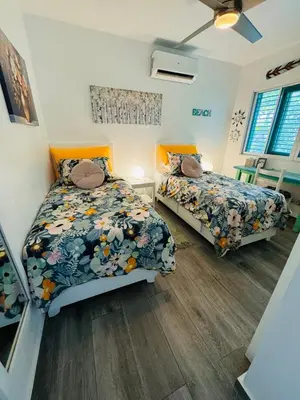 a bedroom with two beds and a window at Las Terrenas La Dolce Vita 7, Captivating and Exciting in Las Terrenas