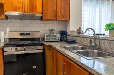a kitchen with a stove and a sink at Apartment in Santo Domingo in Santo Domingo