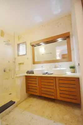 a bathroom with two sinks and a mirror at House with pool 300 m from Las Ballenas beach in Las Terrenas