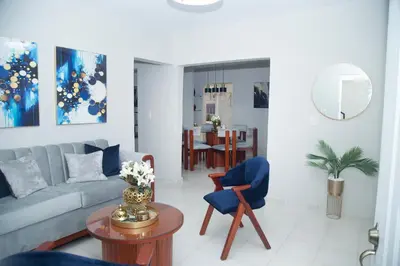 a living room with a couch and a table at Luxury Apartment in Santiago de los Caballeros