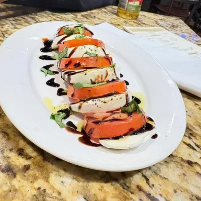 a white plate of food on a table at Casa De Mabel in Santo Domingo