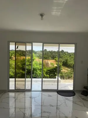an empty room with a large window with a view at Aparta Estudio Disponible