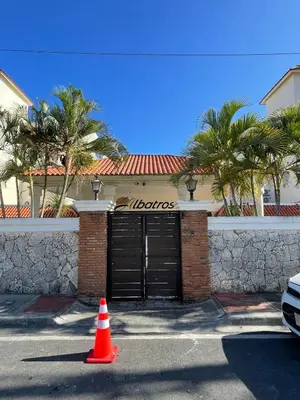 a house with a gate and a traffic cone in front at Juan Dolio paradise in Villas del Mar