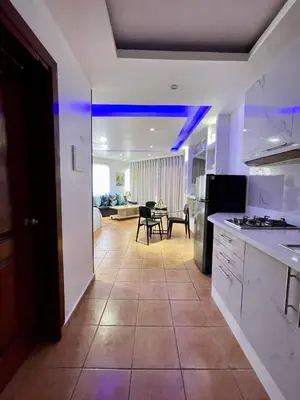 a kitchen with blue lights on the ceiling at Juan Dolio paradise in Villas del Mar
