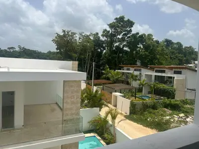 an external view of a house with a swimming pool at Beach and comfort in Las Terrenas