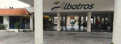 a building with a sign on the front of it at Appartamento Albatros, Juan Dolio in Juan Dolio