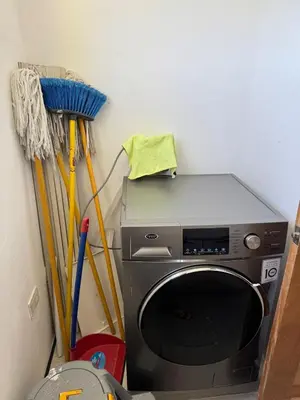 a washing machine in a corner with mop at Luxury apartment in Cabrera in Cabrera