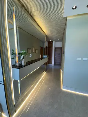 a hallway in a building with lights on the wall at Luxury apartment in Cabrera in Cabrera