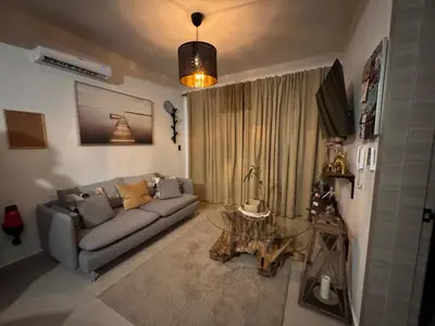 a living room with a couch and a table at Private Lux Oasis, Vista Cana, Punta Cana in Punta Cana