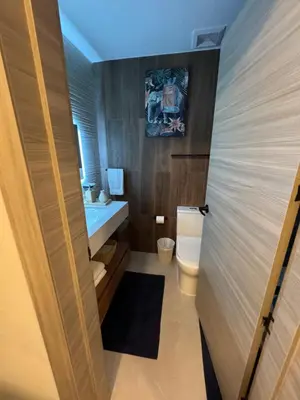 a bathroom with a toilet and a sink at Private Lux Oasis, Vista Cana, Punta Cana in Punta Cana