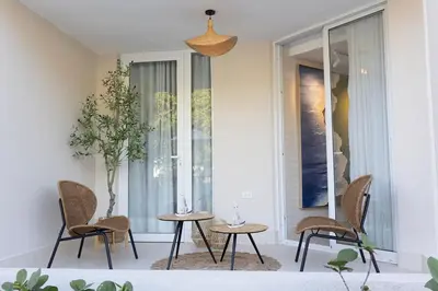 a room with two tables and chairs and a window at Xanadú in Sampiño