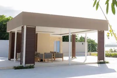 a pavilion with a table and chairs in it at Xanadú in Sampiño