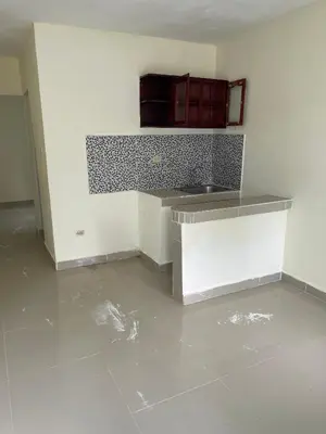 an empty kitchen with a sink and a counter at Alexel Property