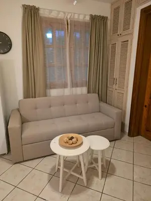 a living room with a couch and a table at Serenity Dominicus in La Laguna