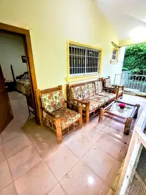a living room with two couches and a table at Paraíso Hortensia Honeymoon Suite in Santiago de los Caballeros