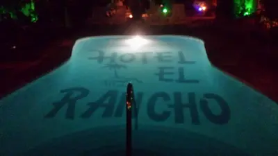 a sign that says hotelel raitz club at night at Hotel El Rancho Sosua in Sosúa