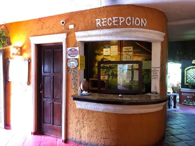 a restaurant with a sign that says reception at Hotel El Rancho Sosua in Sosúa