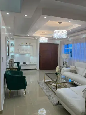 a living room with a couch and a table at Residencial Pancho III in Los Mameyes
