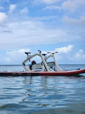 a boat in the water with two people on it at Room 7 in Río San Juan