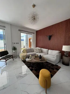 a living room with a couch and a table at Villa Noah in Bayahibe