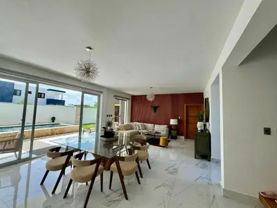 a living room with a glass table and chairs at Villa Noah in Bayahibe