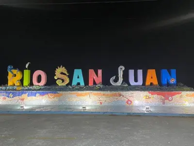 a sign that says hi san jam on a wall at Room 6 in Río San Juan