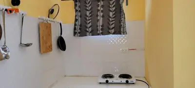 a kitchen with a stove on a counter top at Room 6 in Río San Juan