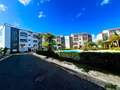 an empty street in front of a large building at Armonía apartment in Las Terrenas