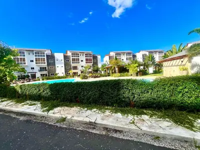 a view of a resort with trees and buildings at Armonía apartment in Las Terrenas