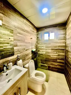 a bathroom with a toilet and a sink at Armonía apartment in Las Terrenas