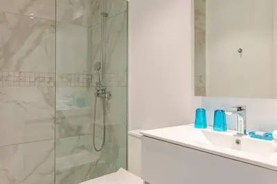 a bathroom with a shower and a sink at Cana Rock Star in Punta Cana