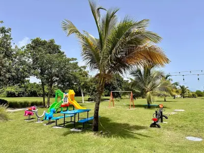 a group of children playing on a playground at Cana Rock Star in Punta Cana