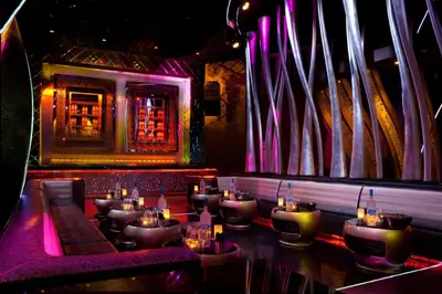 a bar with a bunch of tables in a room at Cana Rock Star in Punta Cana