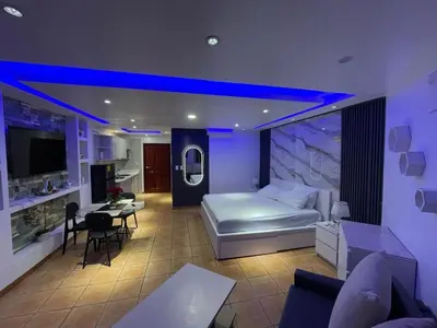 a hotel room with a bed and a dining room at Sea front apartment, Juan Dolio, San Pedro in San Pedro de Macorís