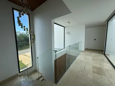 an empty room with glass walls and a large window at Golf 218 Nueva Romana Beach in San Pedro de Macorís