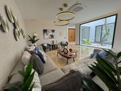 a living room with a couch and a table at Golf 218 Nueva Romana Beach in San Pedro de Macorís