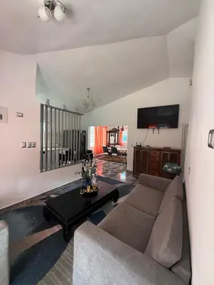 a living room with a couch and a table at Villa Las Tortugas # 2 in Sousa in Sosúa