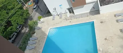 an overhead view of a swimming pool in a building at Apartamento en Boca Chica T1 610 in Boca Chica